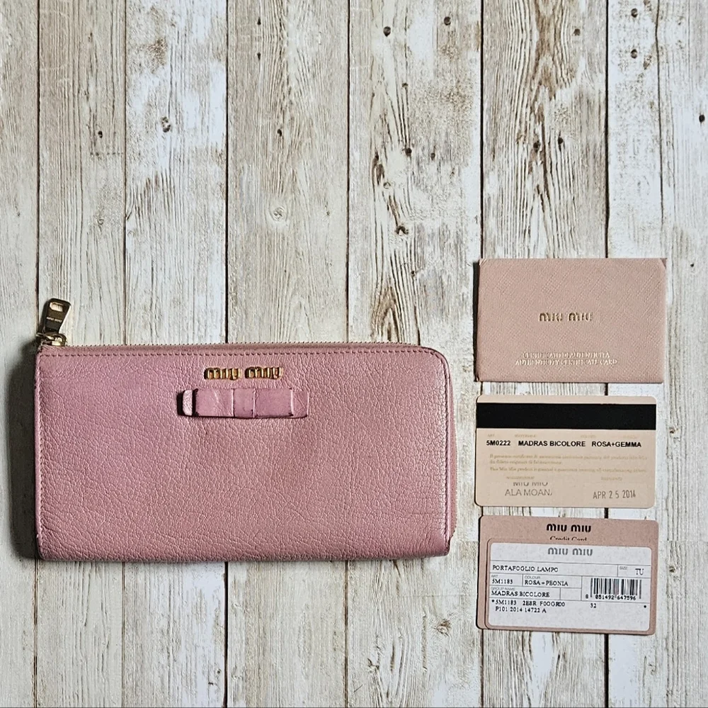 Miu Miu Pink Wallet with Elegant Zip Closure